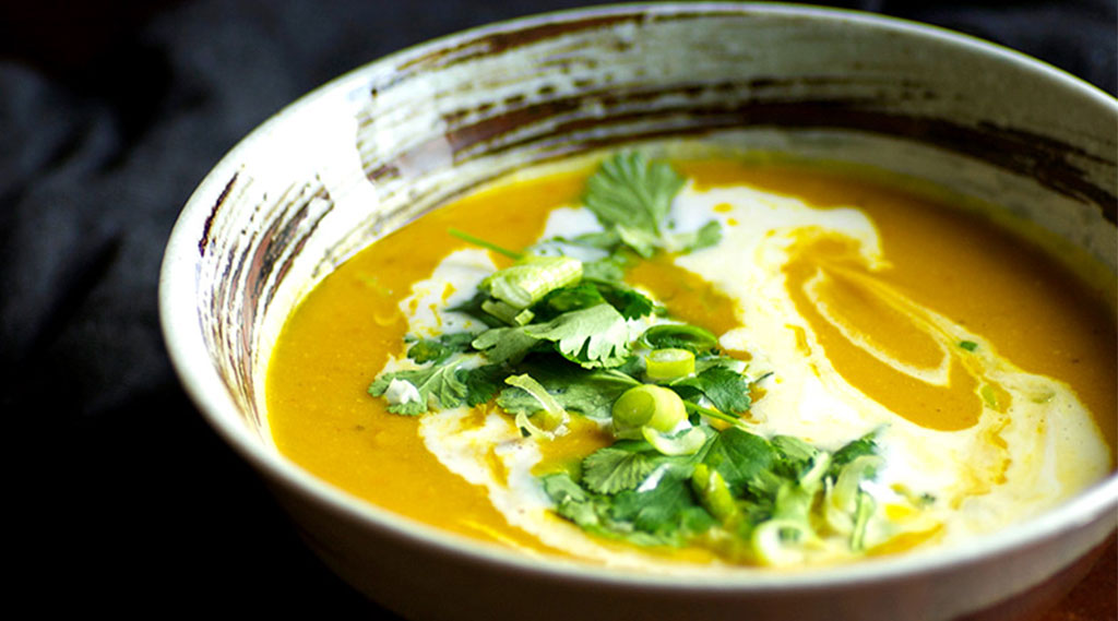 soup with fresh herbs on top