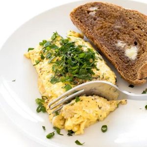 Herb scrambled eggs with thyme, oregano, parsley and chives
